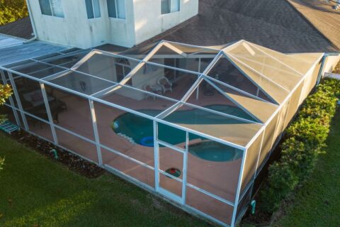 Screened pool enclosure with patio and outdoor seating in Virginia & Maryland