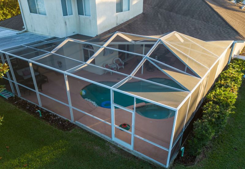 Screened pool enclosure with patio and outdoor seating in Virginia & Maryland