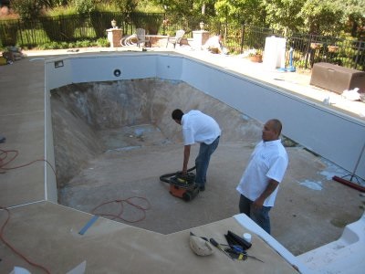 men working on pool