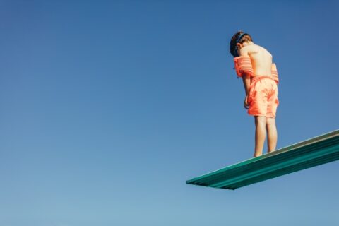 Young Boy On Diving Board