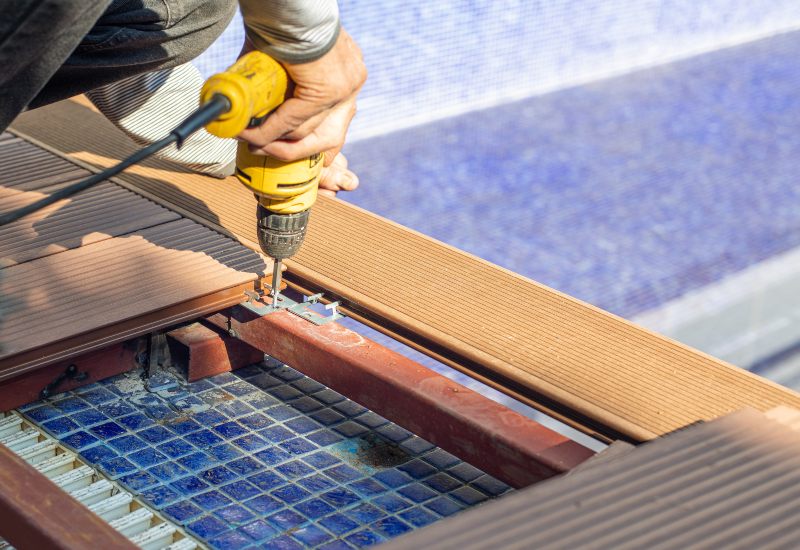 Workers Renovating a Residential Swimming Pool for Millennium Pools & Spas in Maryland