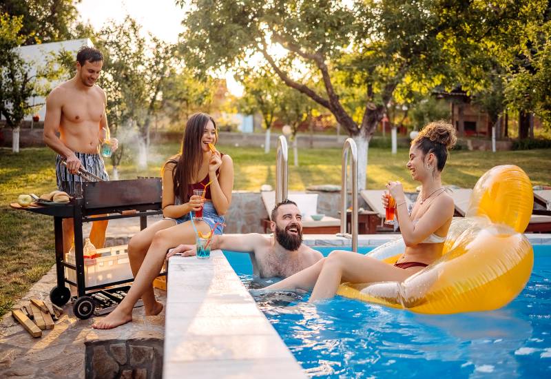 People Relaxing in a Residential Backyard Pool in Virginia & Maryland