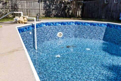 An In-Ground Pool Is Being Drained in the Backyard of Virginia & Maryland