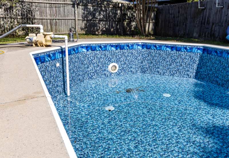 An In-Ground Pool Is Being Drained in the Backyard of Virginia & Maryland