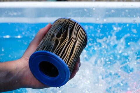 Pool Expert Holding a Dirty Pool Filter in Virginia & Maryland
