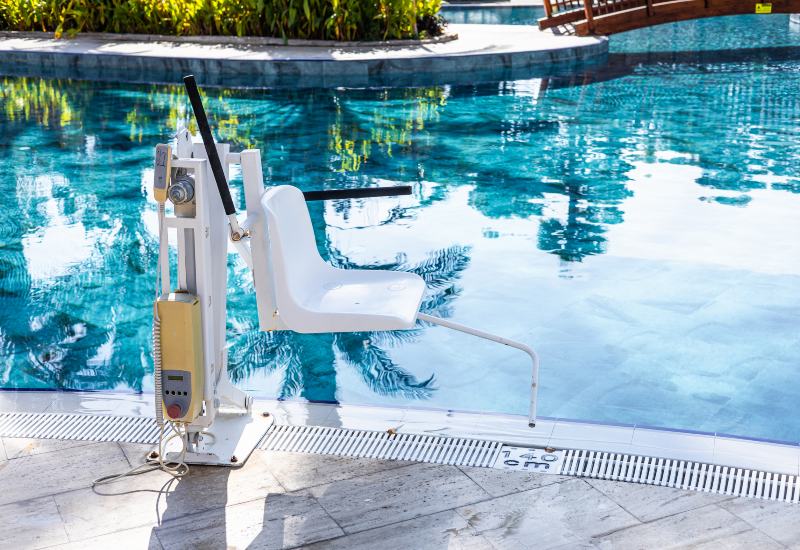 Poolside ADA Compliance lift chair beside a commercial swimming pool in Virginia & Maryland