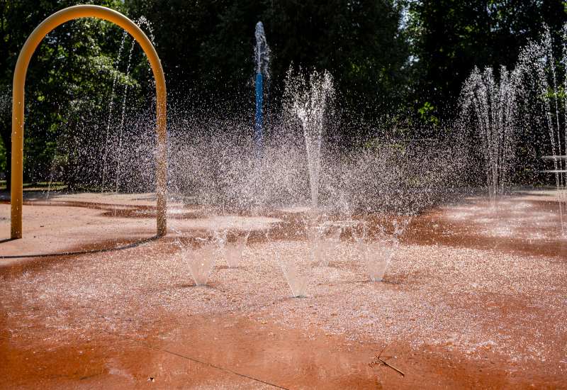Water splash pad with fountain jets in a sunny park in Virginia & Maryland
